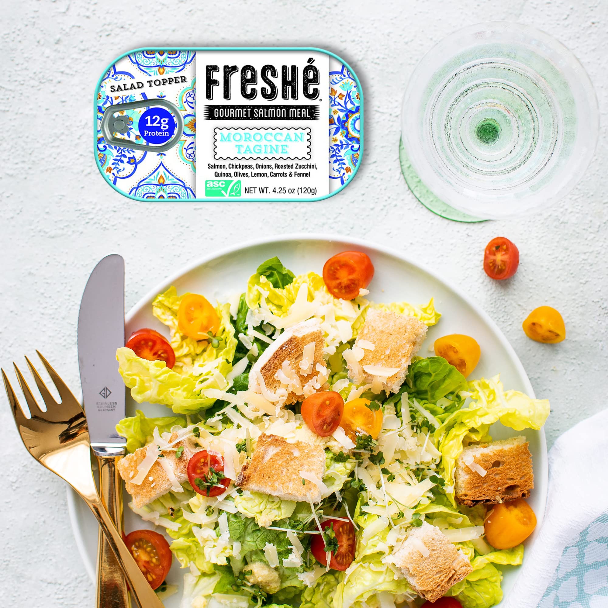 Freshé tin in hand for scale showing compact size and travel convenience