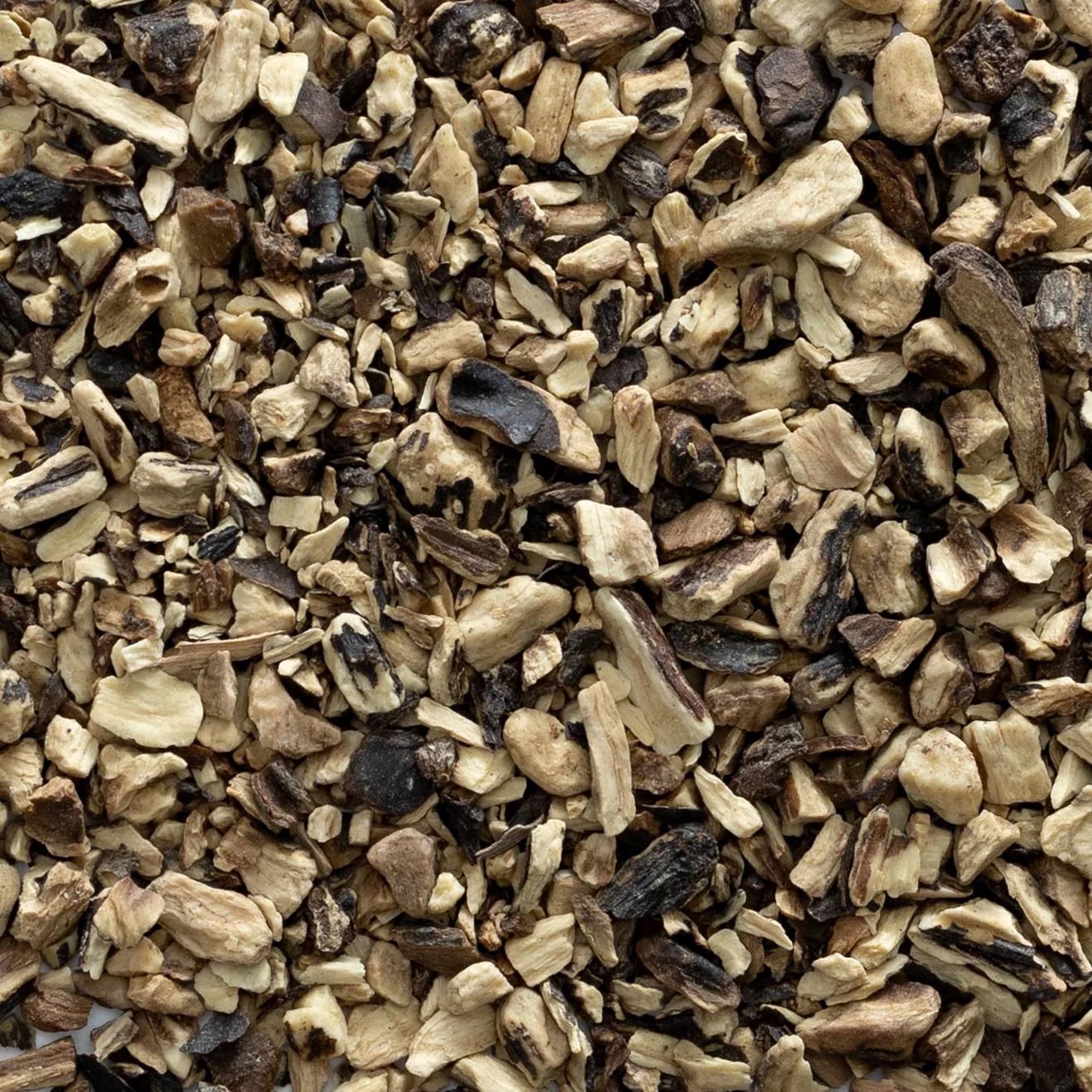 Frontier Co-op comfrey root steeping in jar of oil demonstrating infusion for topical use