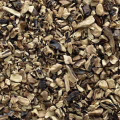 Frontier Co-op comfrey root steeping in jar of oil demonstrating infusion for topical use
