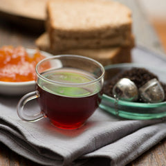 Frontier Co-op brewed cup of black tea steaming for robust morning flavor