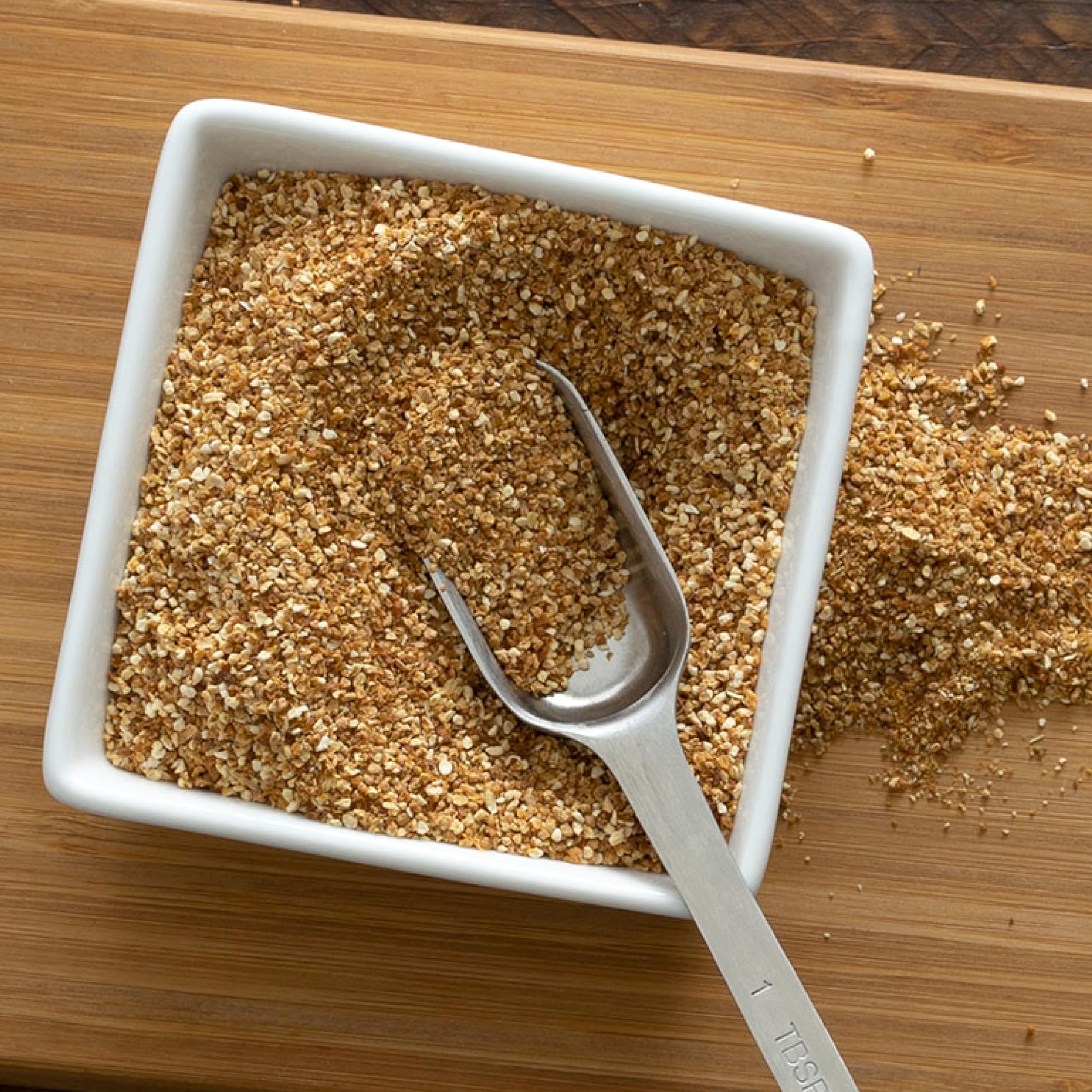 Frontier Co-op granules heaped on measuring spoon demonstrating portion control benefit