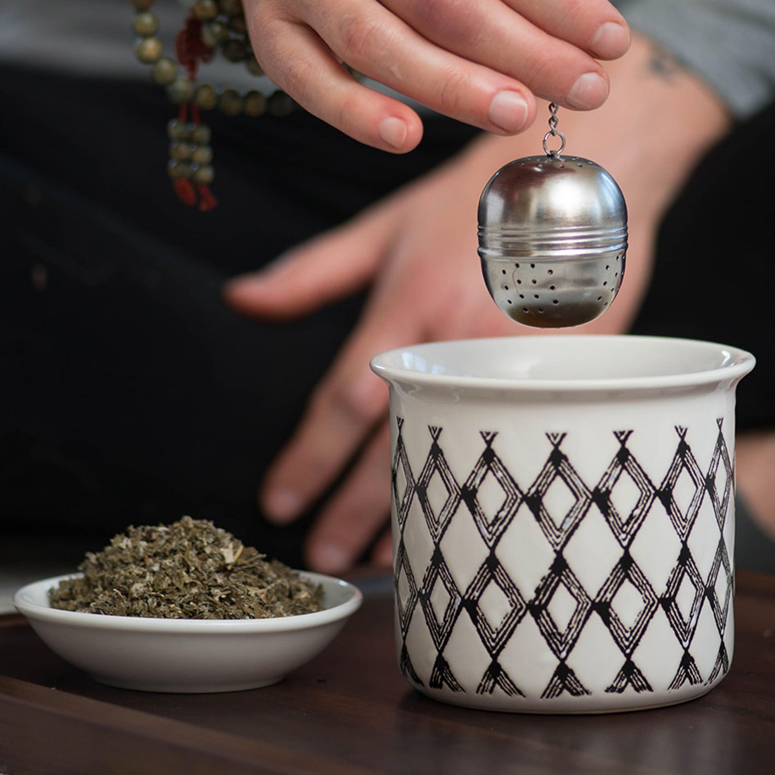 Jar of oil infusion with Frontier Co-op red raspberry leaf showing DIY body-care potential