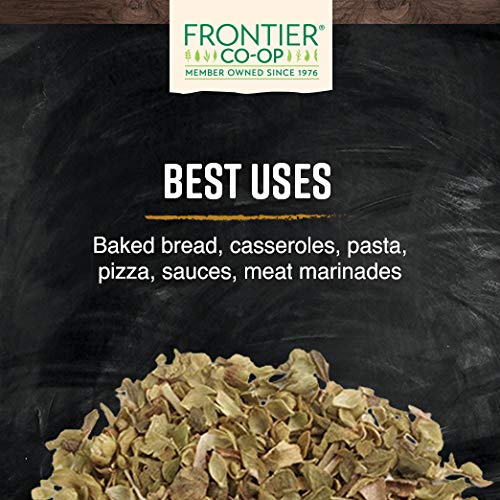 Frontier Co-op oregano in measuring cup demonstrating bulk quantity and scale