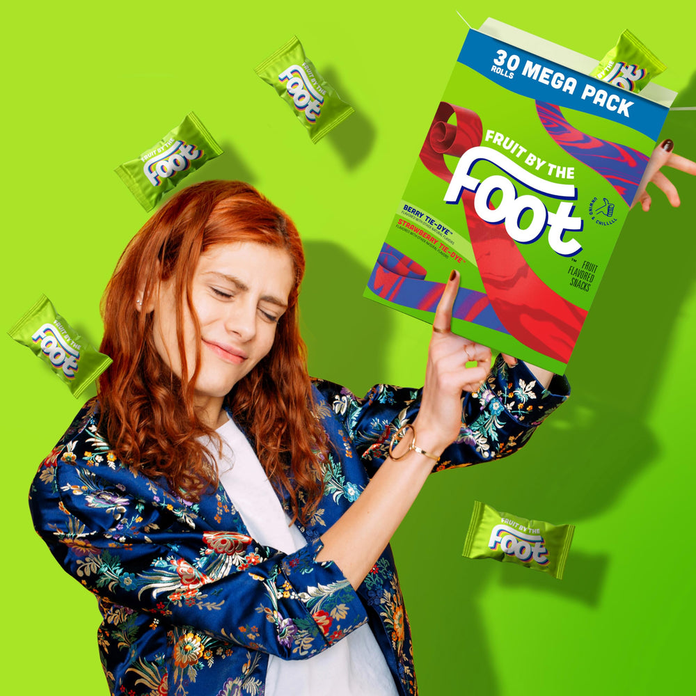 Fruit by the Foot roll beside a lunchbox showing scale and easy packing