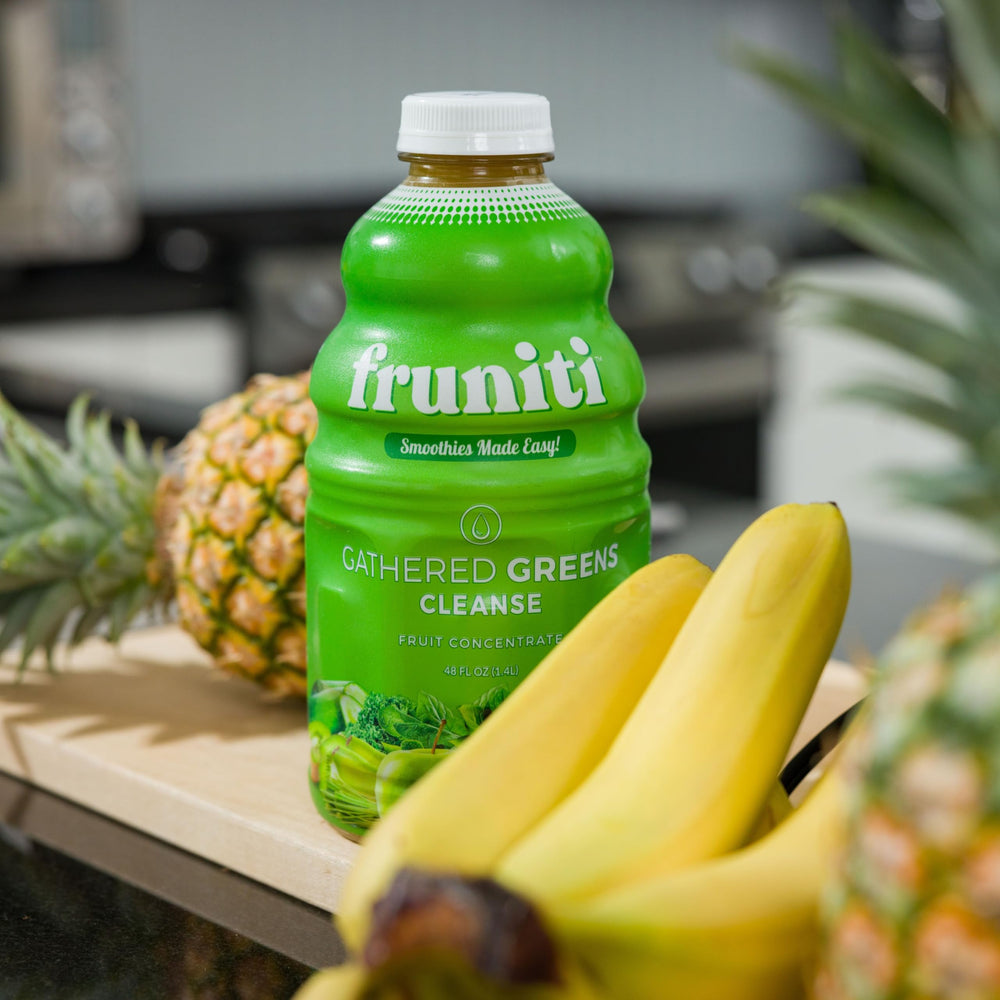 Fruniti bottle in hand for scale demonstrating compact, travel-friendly size