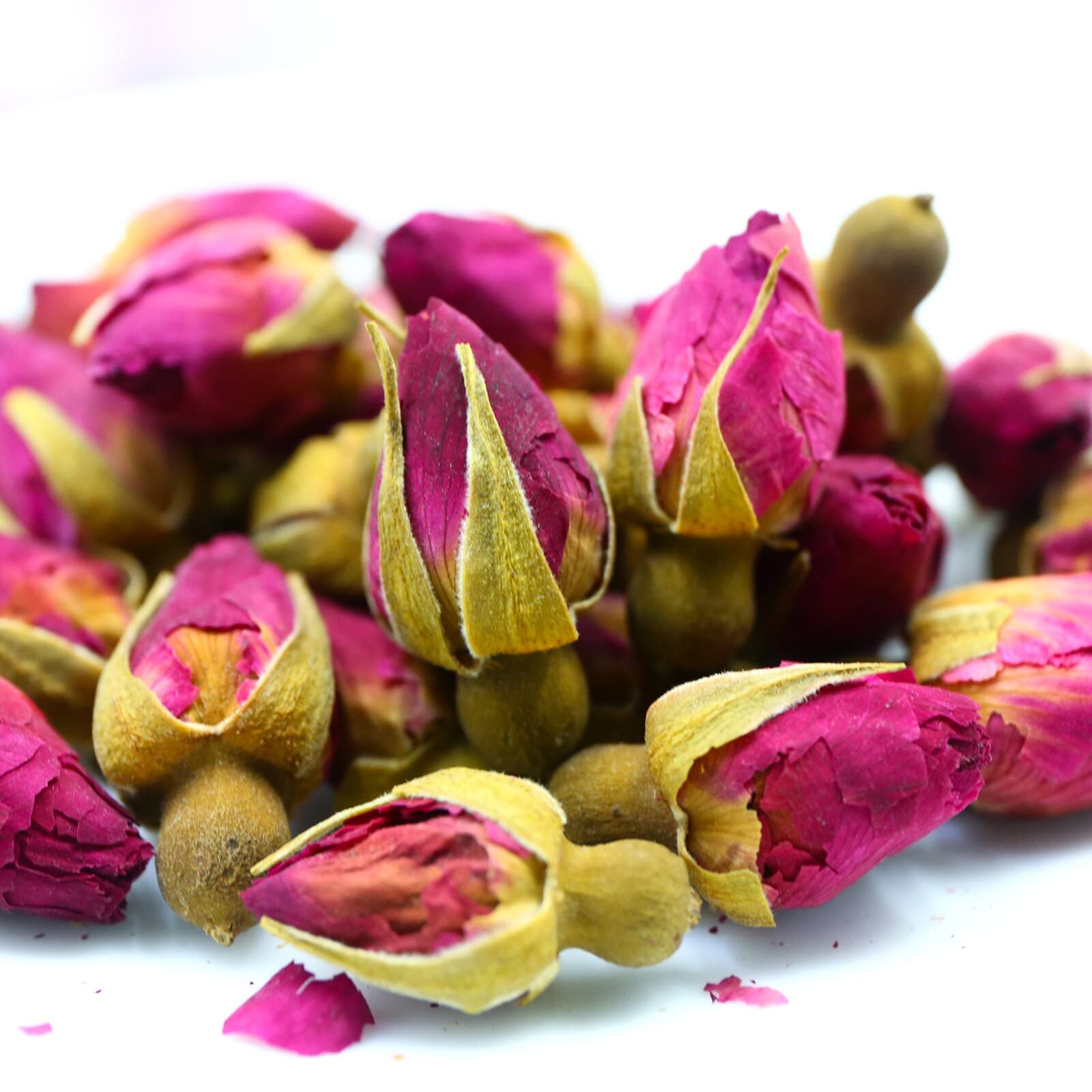 FullChea rose buds steeping in teacup showing clear infusion and aroma