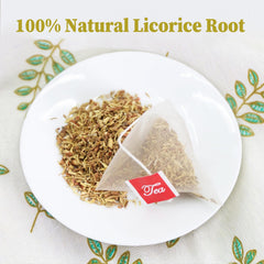 FullChea close-up of a finely ground licorice tea bag releasing flavor