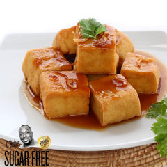 G Hughes sweet and sour sauce in bowl with egg rolls offering tasty dip