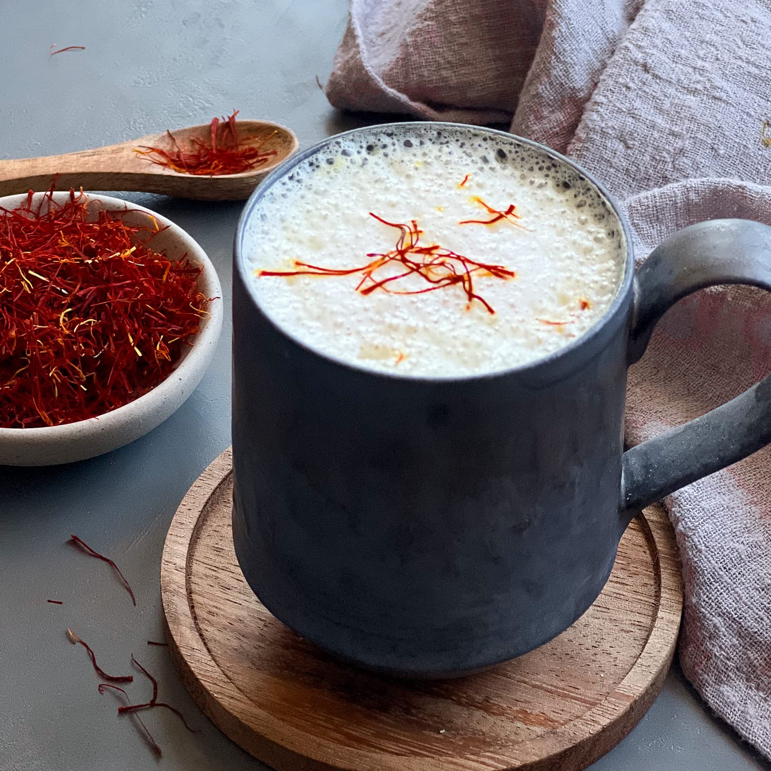 open 1 gram tin of The Gathering Of Saffron threads showing pure all-red strands and portion control