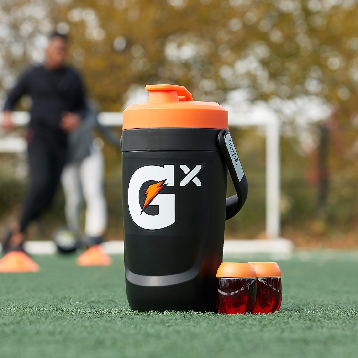 Gatorade jug on sideline with team cooler showing game-day-ready convenience