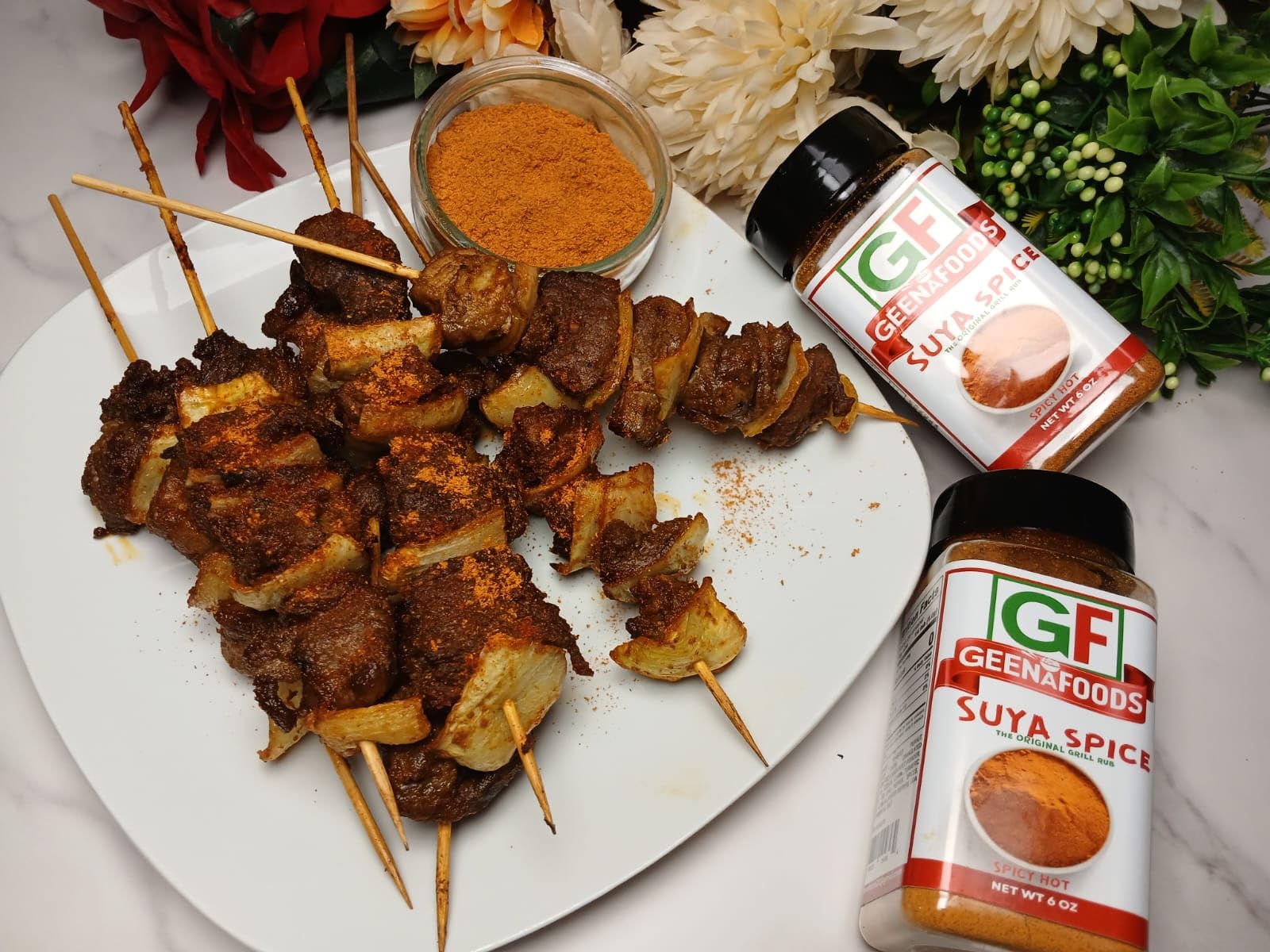 Geenafoods served alongside grilled platter in lifestyle shot showing meal enhancement and authenticity