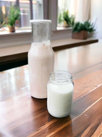Generic milk kefir grains on kitchen counter with ingredients benefit: conveys home fermentation lifestyle