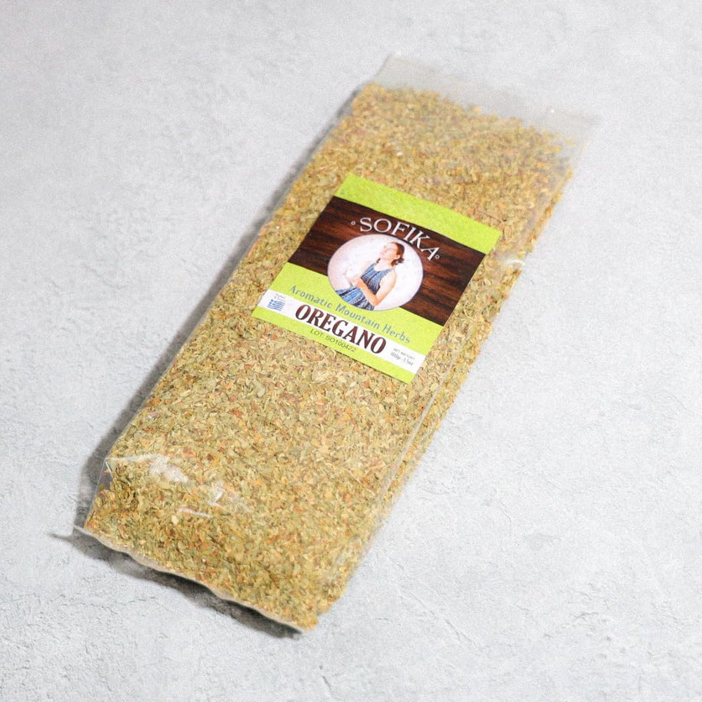 Generic oregano next to measuring spoon for scale and generous 100g value benefit