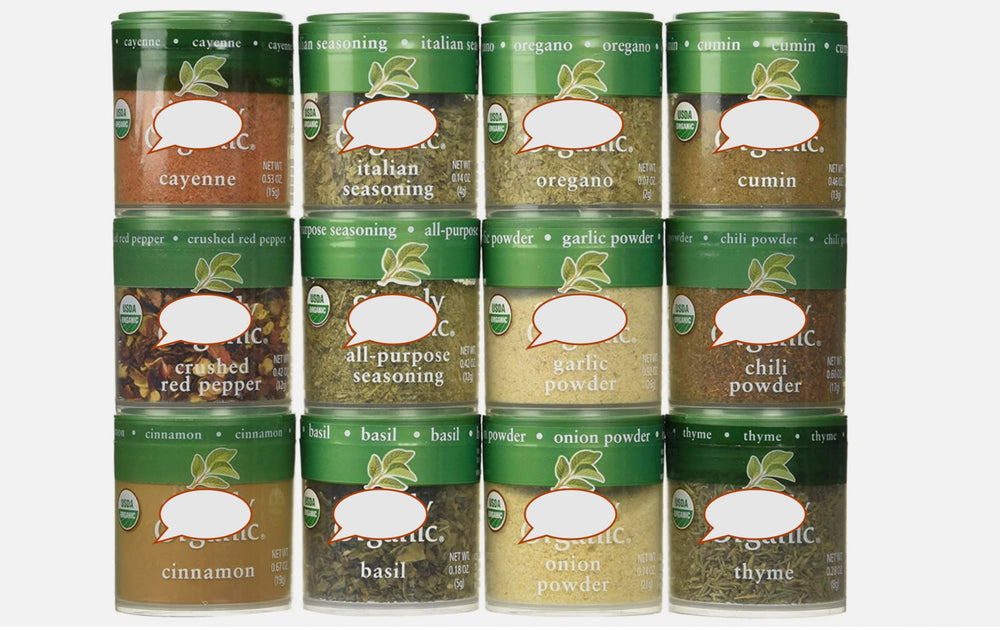 Generic brand spices in use on kitchen counter, small bottles open for cooking convenience and freshness