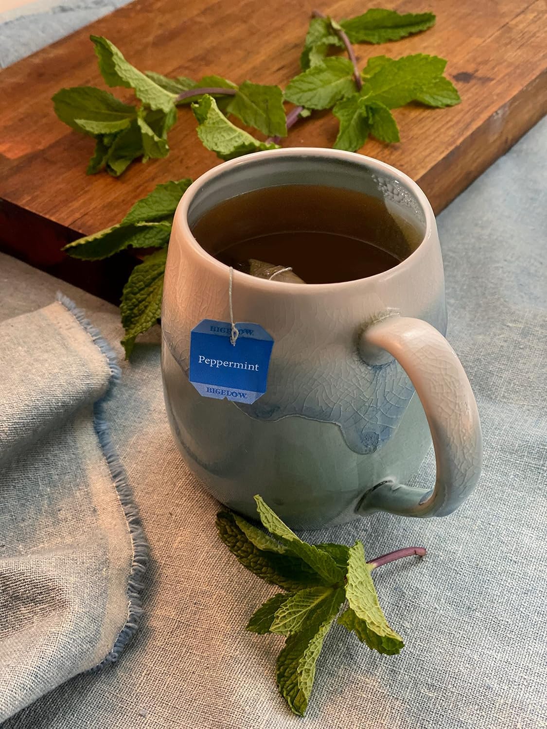 Generic brand loose botanicals beside tea bag showing natural ingredients