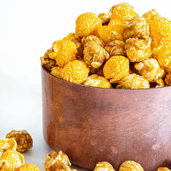 G.H. Cretors popcorn mix texture close-up showing crispy caramel and cheddar contrast