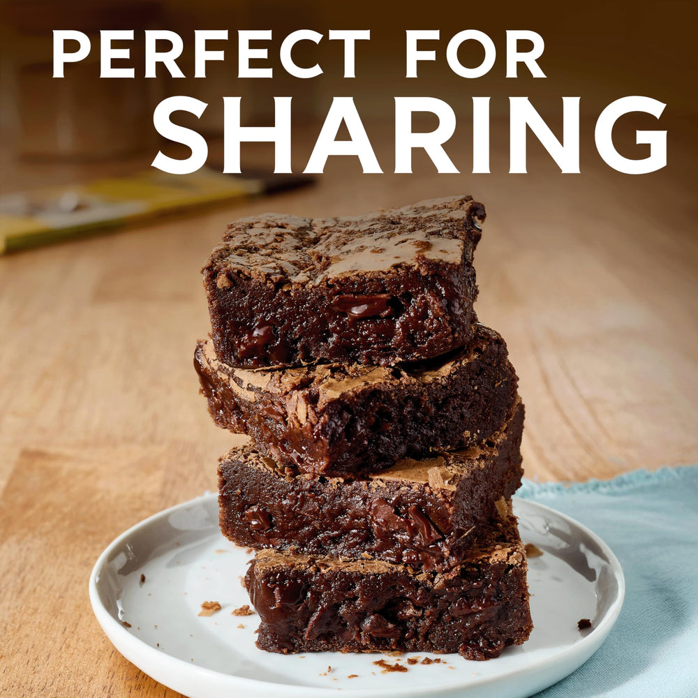 Ghirardelli brownies topped with chocolate shavings for rich flavor