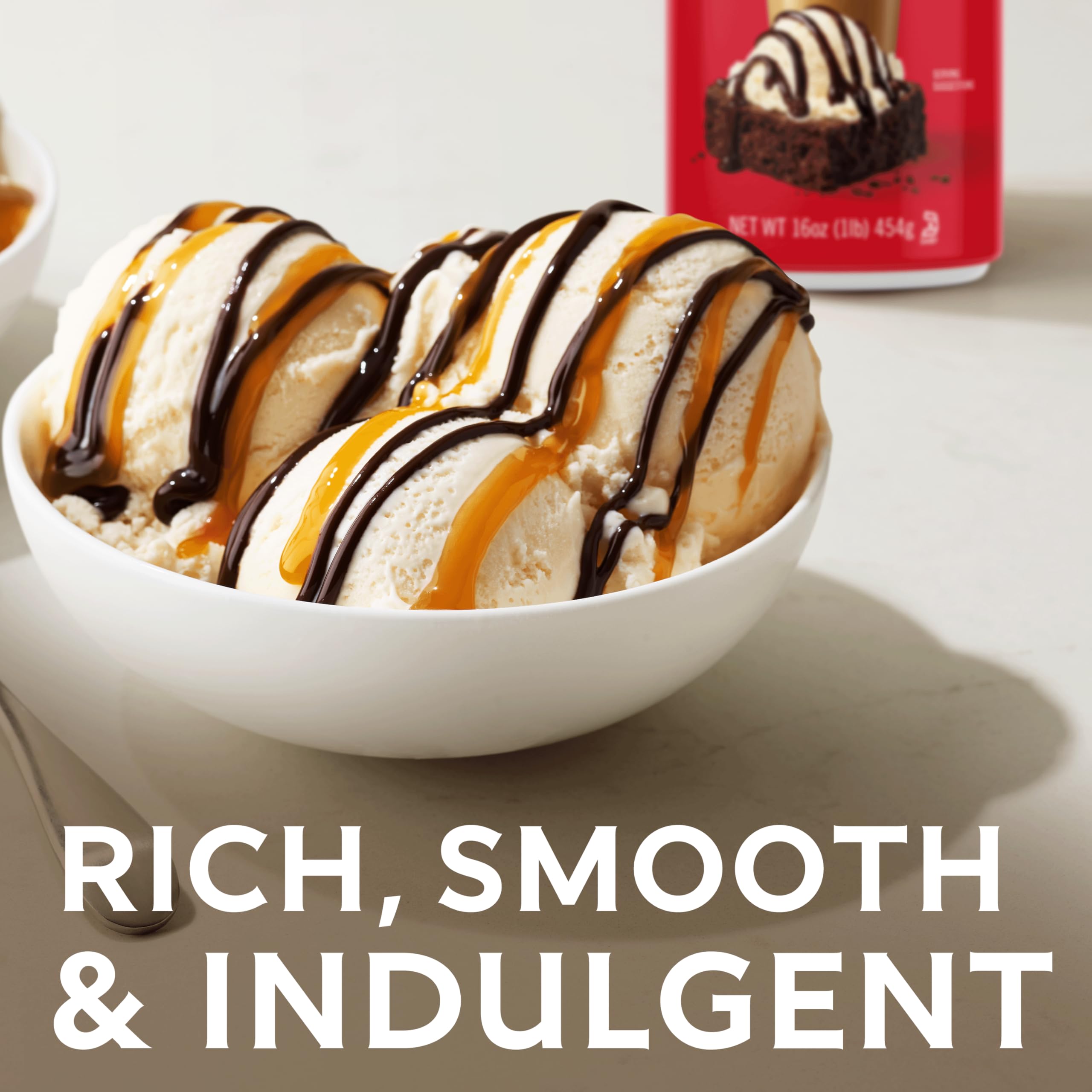 Ghirardelli pouring sauce over ice cream, creates glossy chocolate ribbons