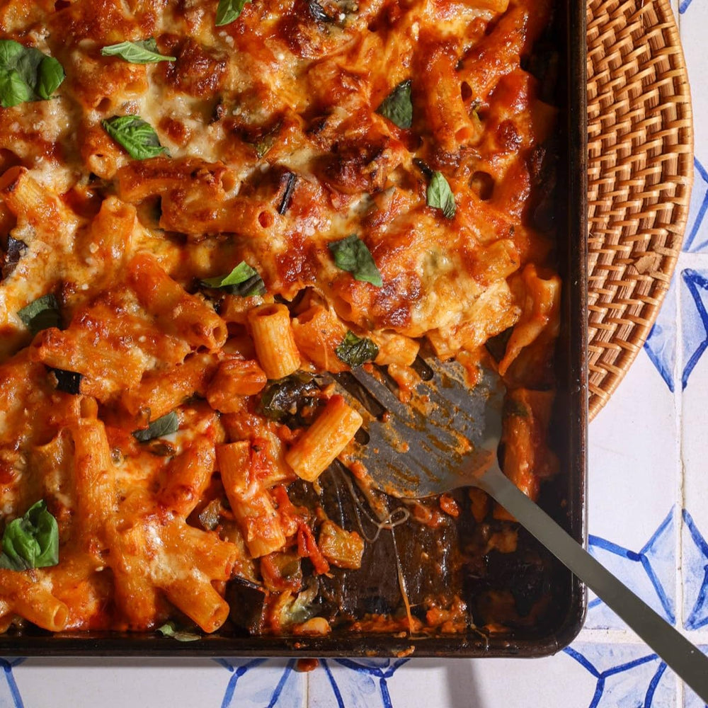 Giadzy ziti and rigatoni plated with ragù showing hearty sauce adhesion