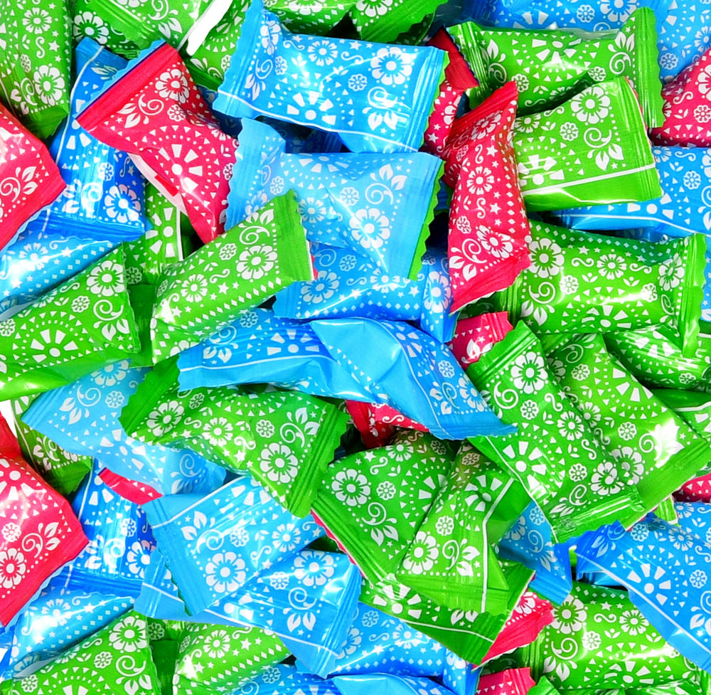 Gift Boutique close-up of papel picado styled wrappers adding festive color