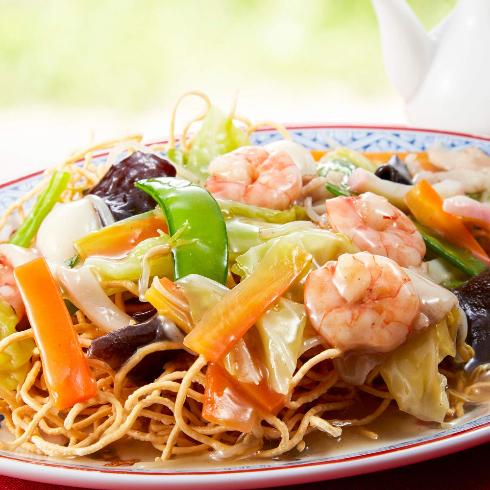 GLUTEN FREE MEISTER noodles beside a cup for scale showing single-serving portion control benefit