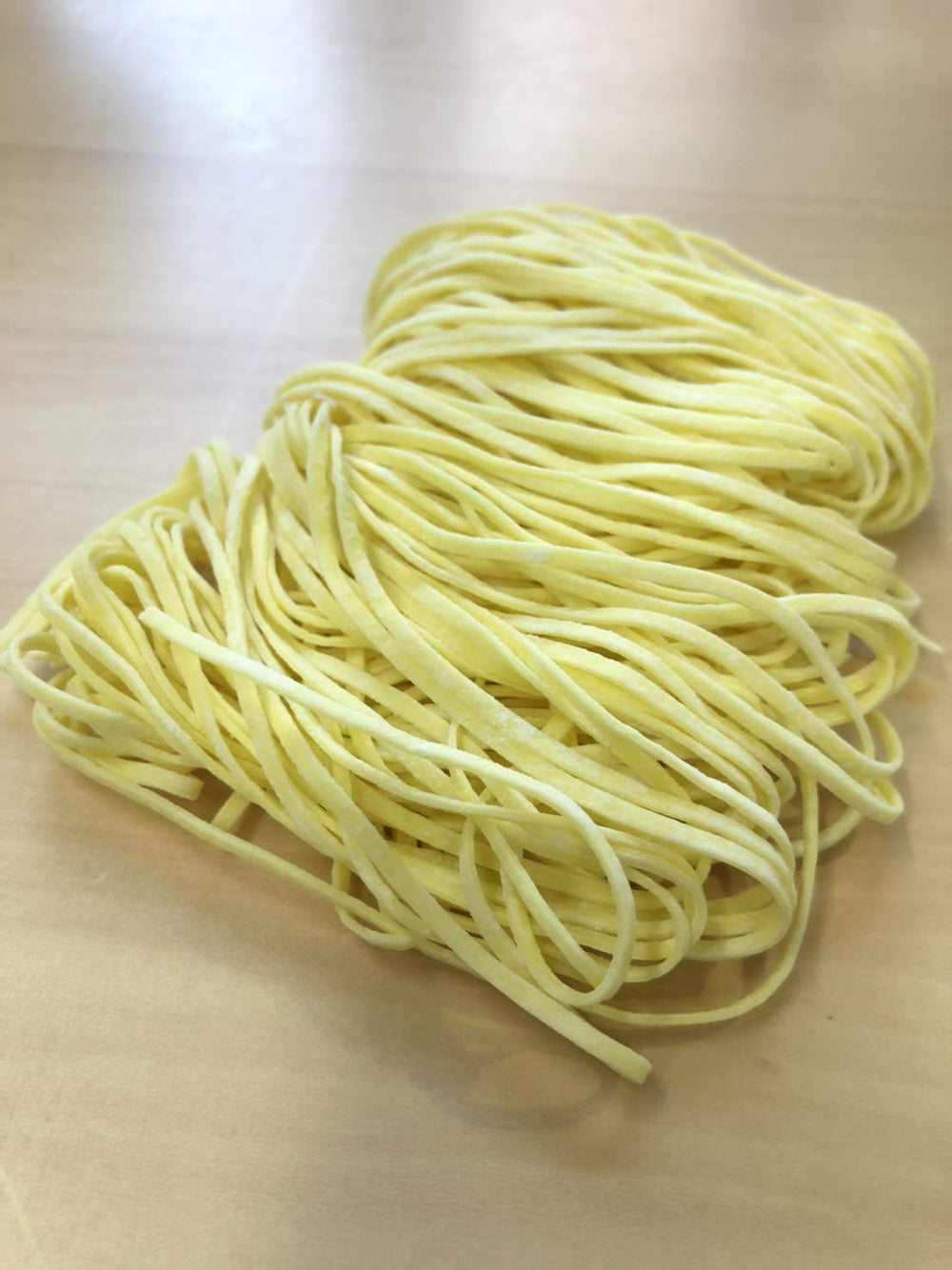Gluten Free Meister noodle pack held in hand to show portion size