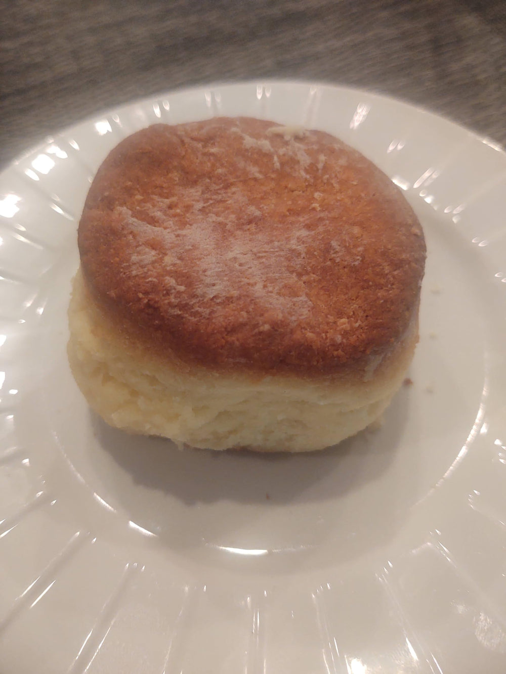 GLUTEN FREEEE biscuits plated with gravy suggesting comforting meal pairing