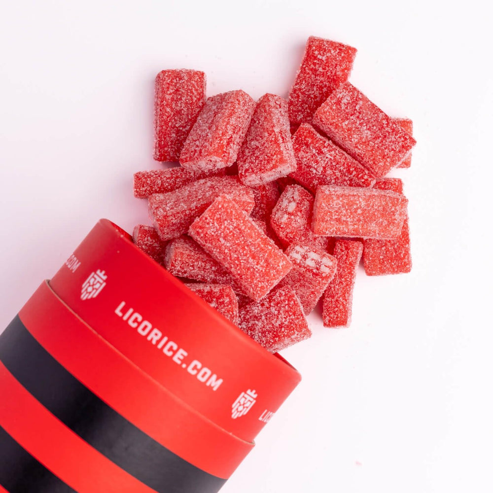 Goat Foods licorice next to a ruler showing piece size and portion guidance for shoppers