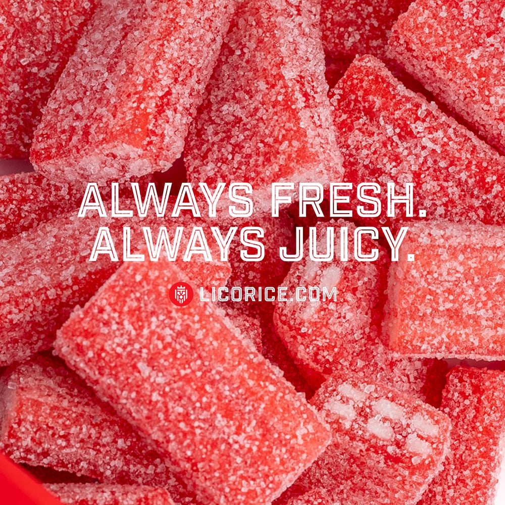 Close-up of Goat Foods strawberry sour licorice showing berry coating and bright flavor cue