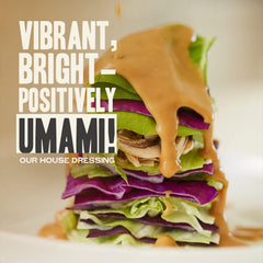 Gojo dressing poured over salad showing bright flavor enhancement