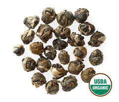 Golden Moon close-up of tightly rolled dragon pearls showing whole-leaf quality