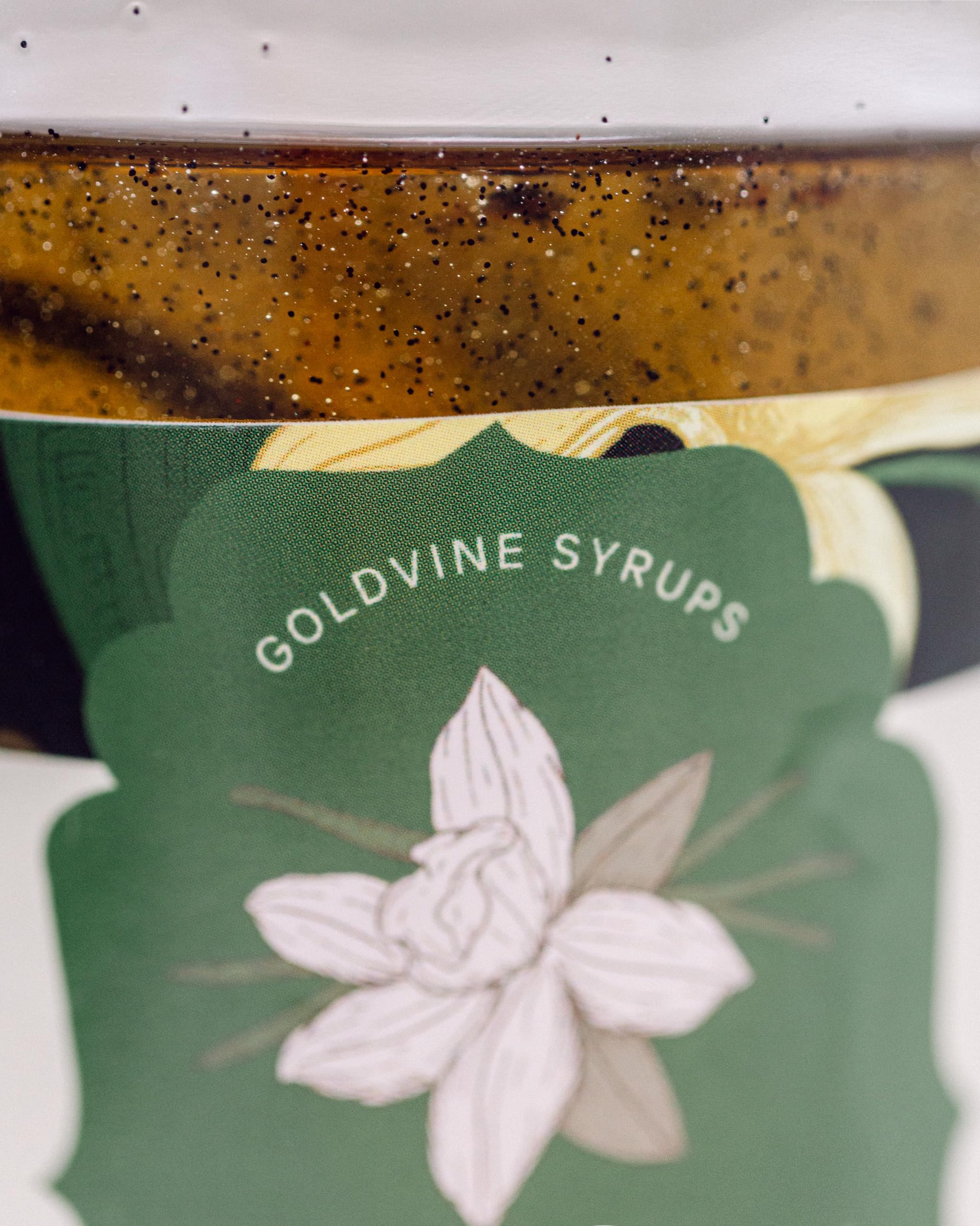 Goldvine pouring vanilla syrup onto espresso to enrich flavor and aroma benefit