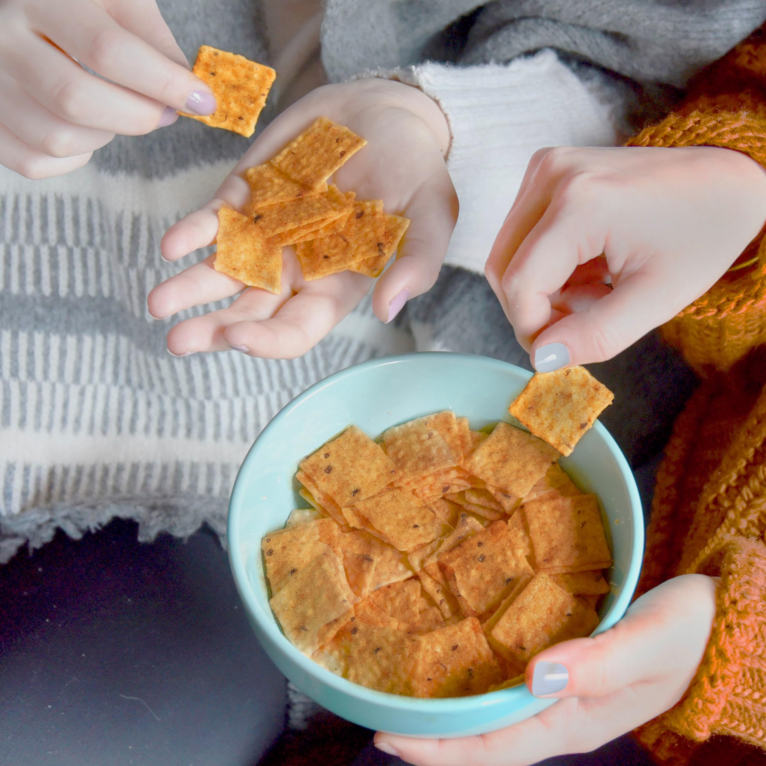 Good Thins crackers beside a salad bowl offering light crunch pairing