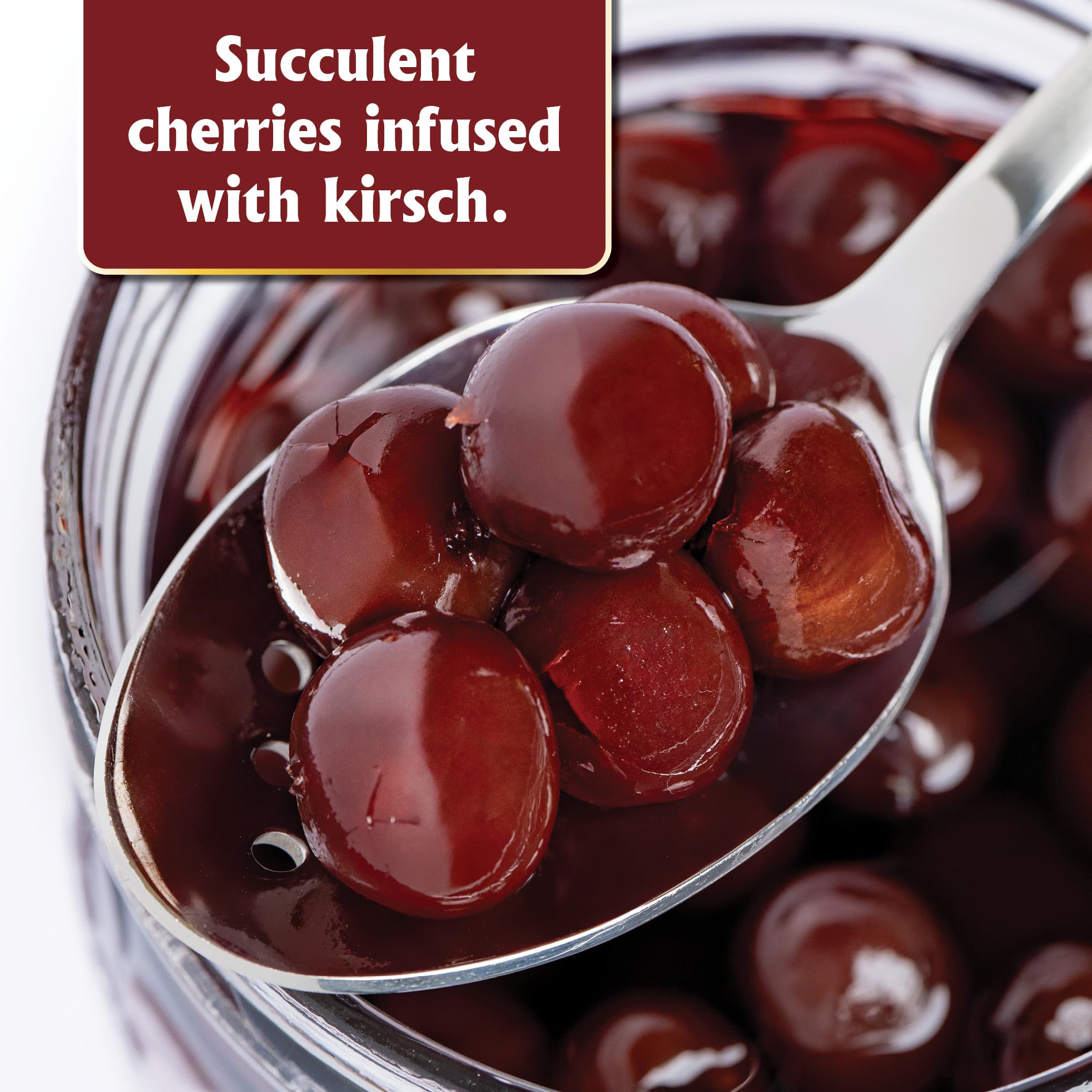 Kirsch syrup pouring from Gourmanity jar emphasizing boozy aromatic boost