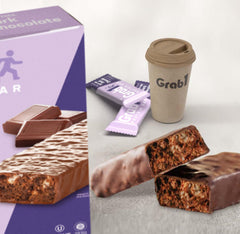 GRAB1 partially unwrapped bar close-up showing chewy texture and satisfying bite