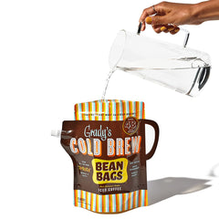 Grady's Cold Brew bean bag steeping in a pitcher in fridge demonstrating easy cold brew preparation