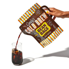 Glass of iced Grady's Cold Brew concentrate diluted and served showing bold flavor and refreshment