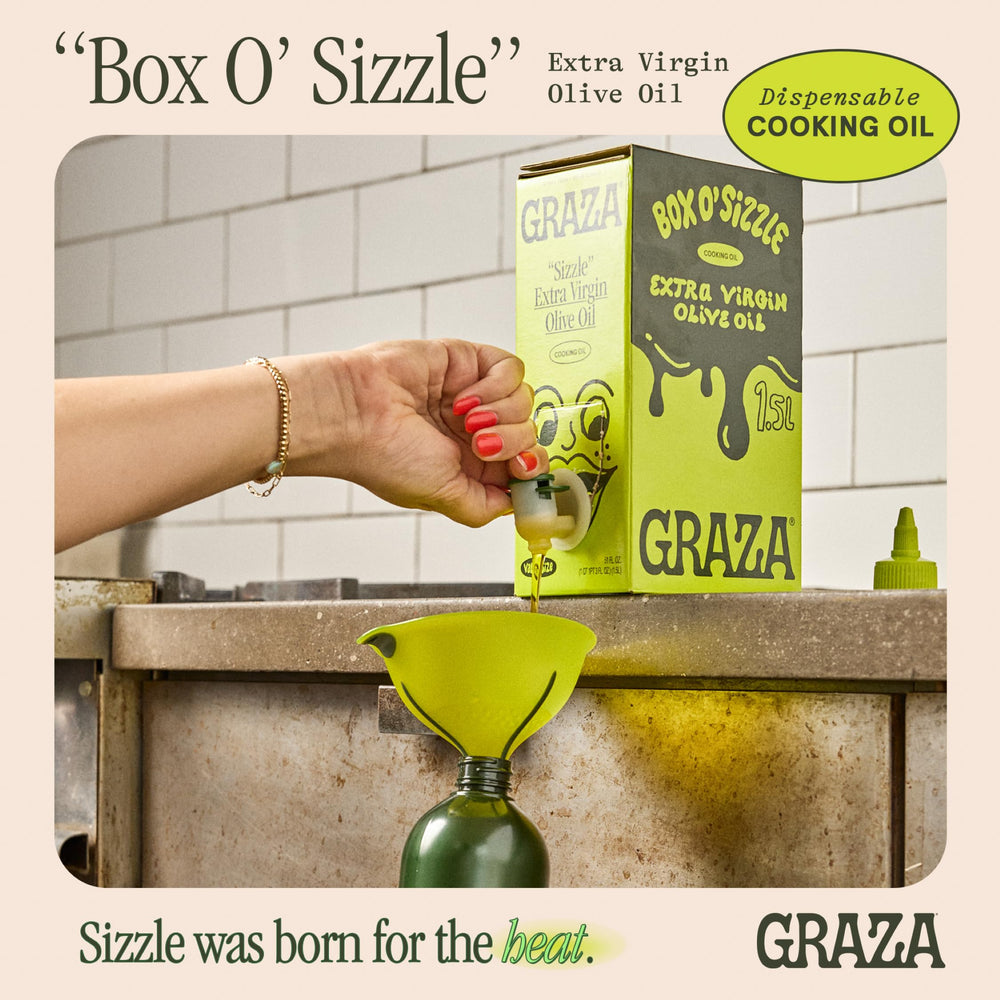 Graza Sizzle pour spout in use for controlled, drip-free pouring