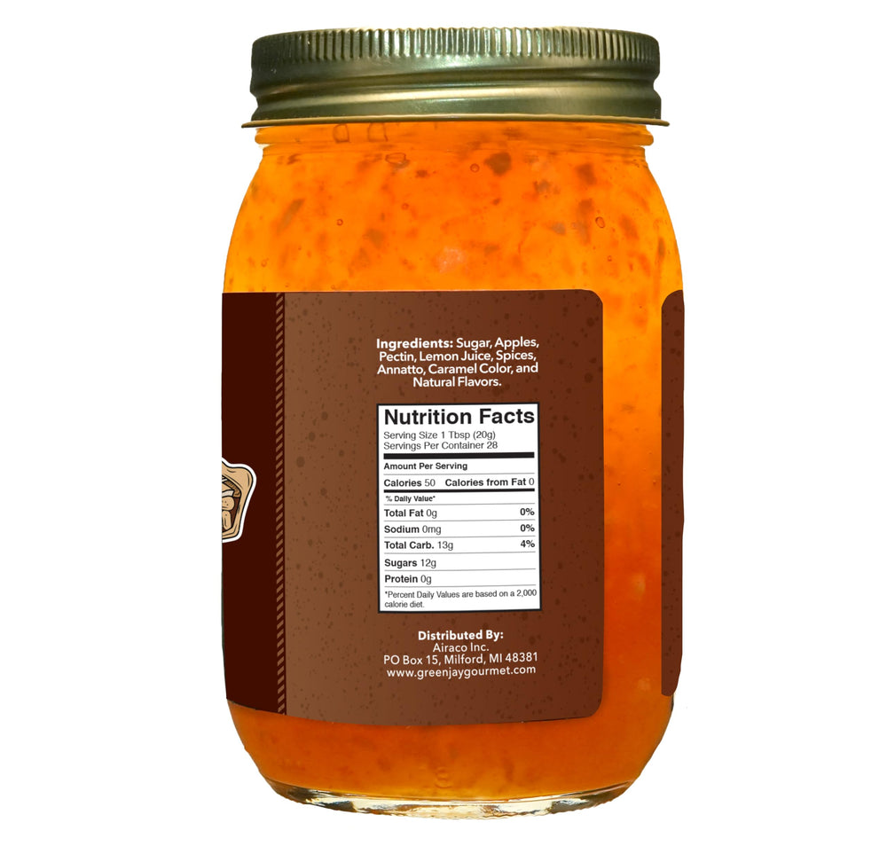 Green Jay Gourmet jam on spoon showing smooth apple cinnamon texture and spreadability