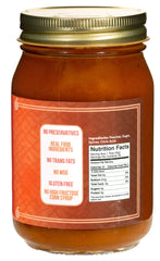 Green Jay Gourmet jar open with spoonful highlighting smooth spreadability benefit