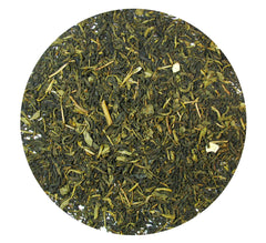 Greenhilltea brewed cup showing clear amber liquor and fragrant steam for calming sip