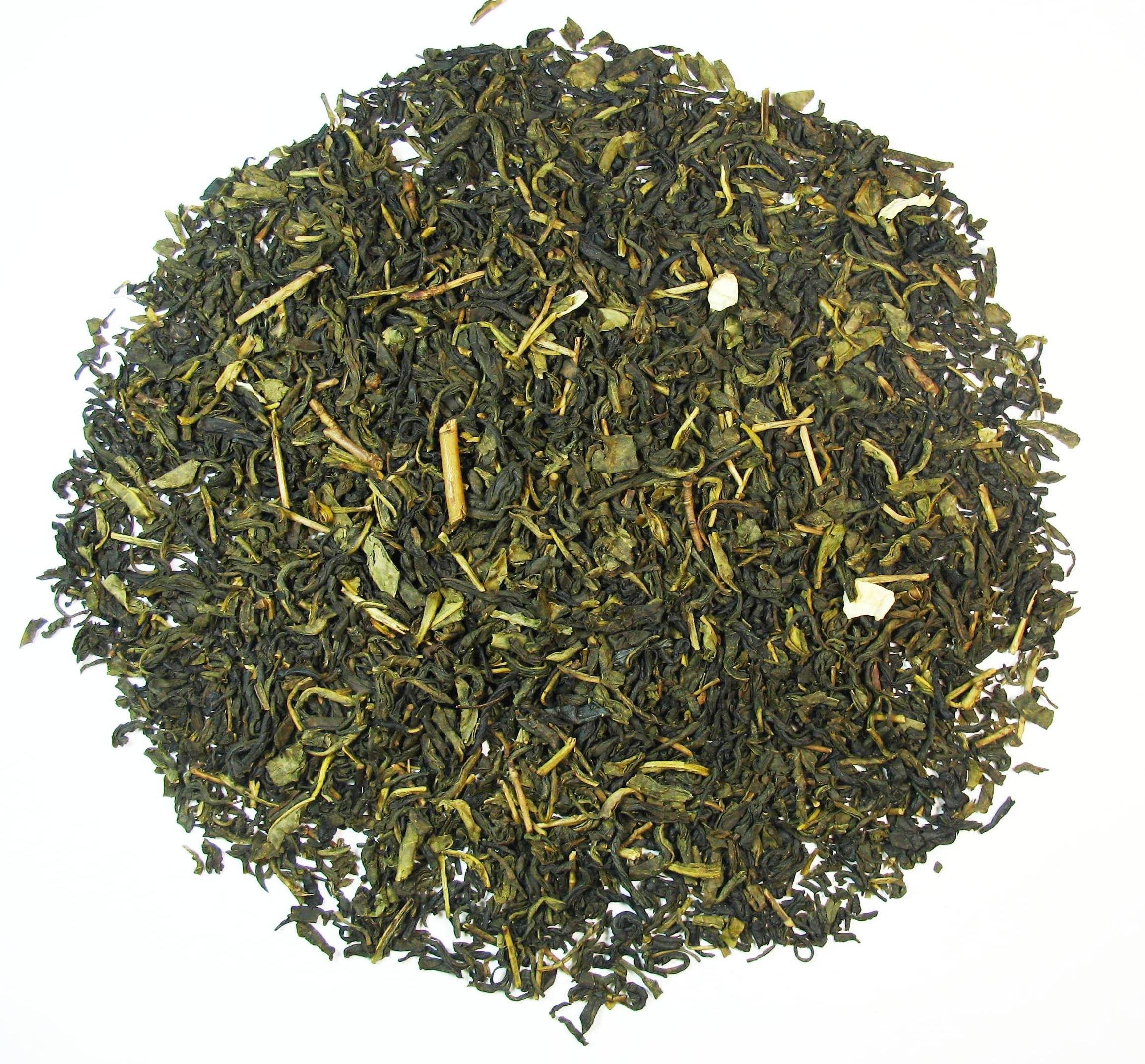 Greenhilltea 8 oz bag beside teaspoon for scale, showing generous loose leaf quantity