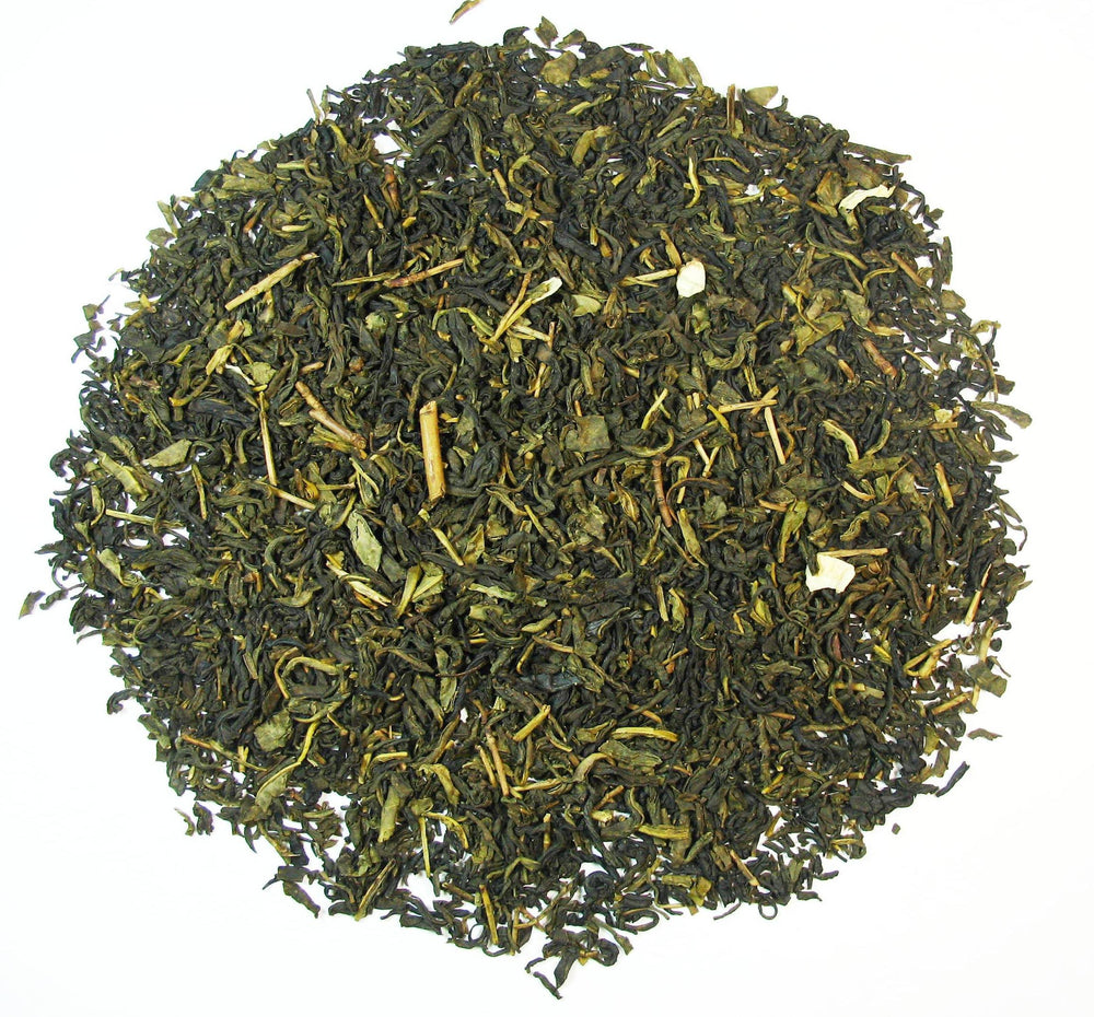 Greenhilltea 8 oz bag beside teaspoon for scale, showing generous loose leaf quantity