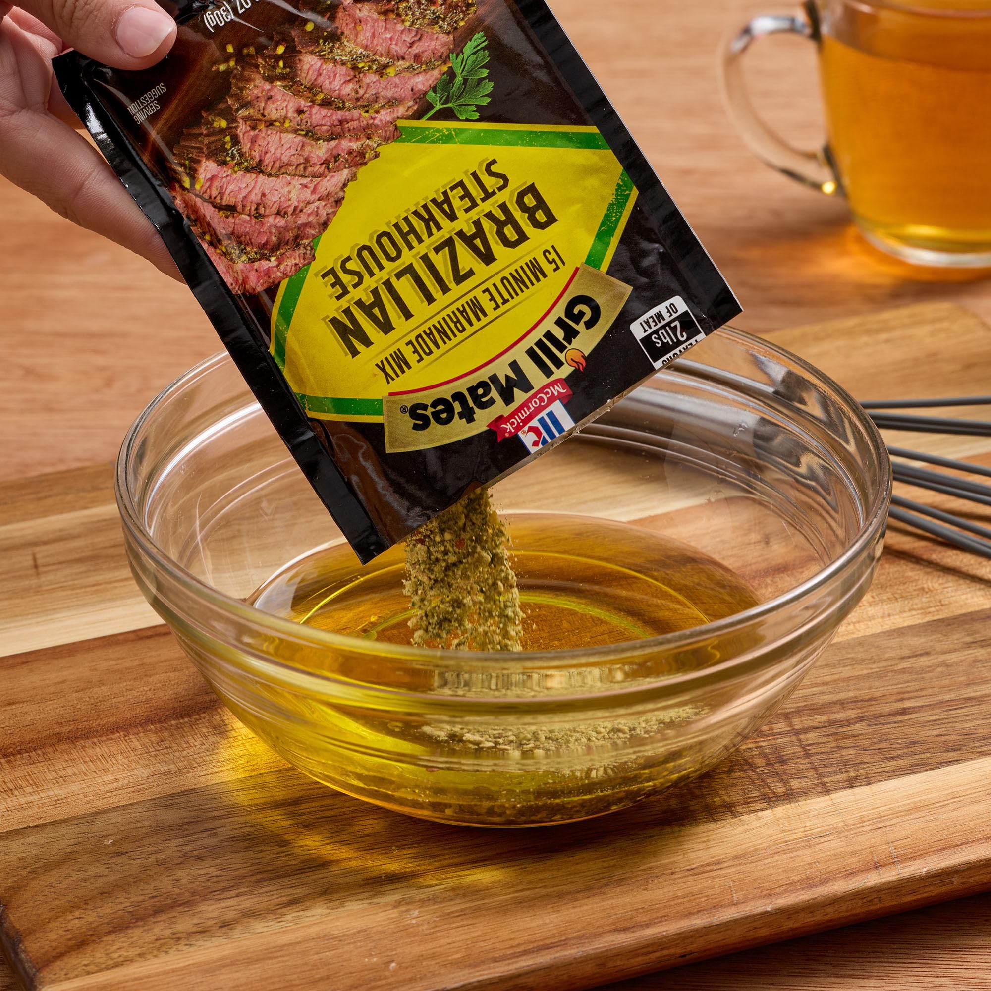 Grill Mates jar next to kitchen ruler showing compact 2.12 oz size benefit
