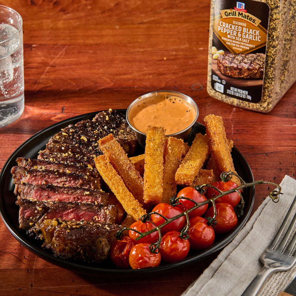 Grill Mates container held in hand to show large 27.52 oz size
