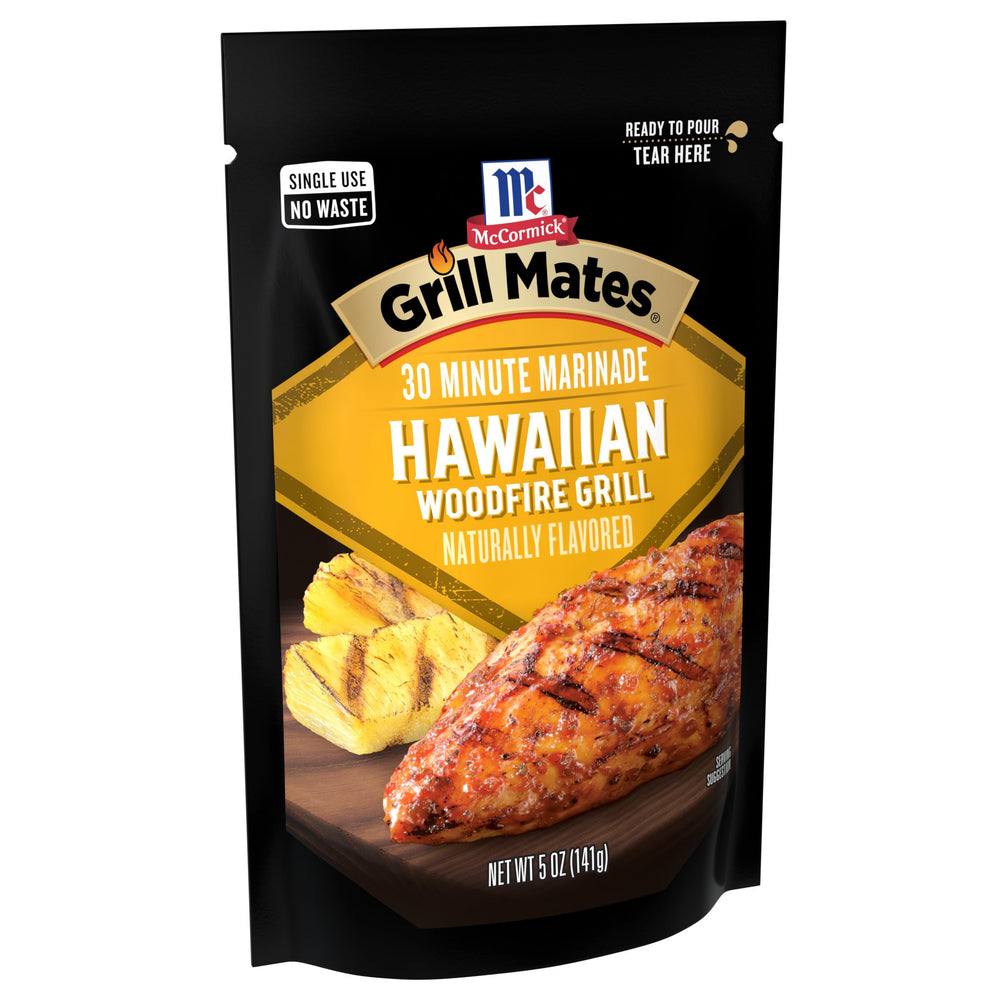 Grill Mates pouch torn and pouring marinade over protein, convenient quick-use benefit
