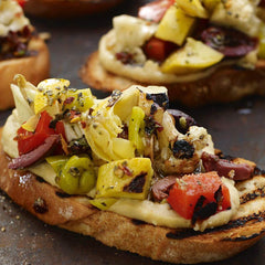 Grill Mates marinated chicken grilling with visible char and boosted flavor