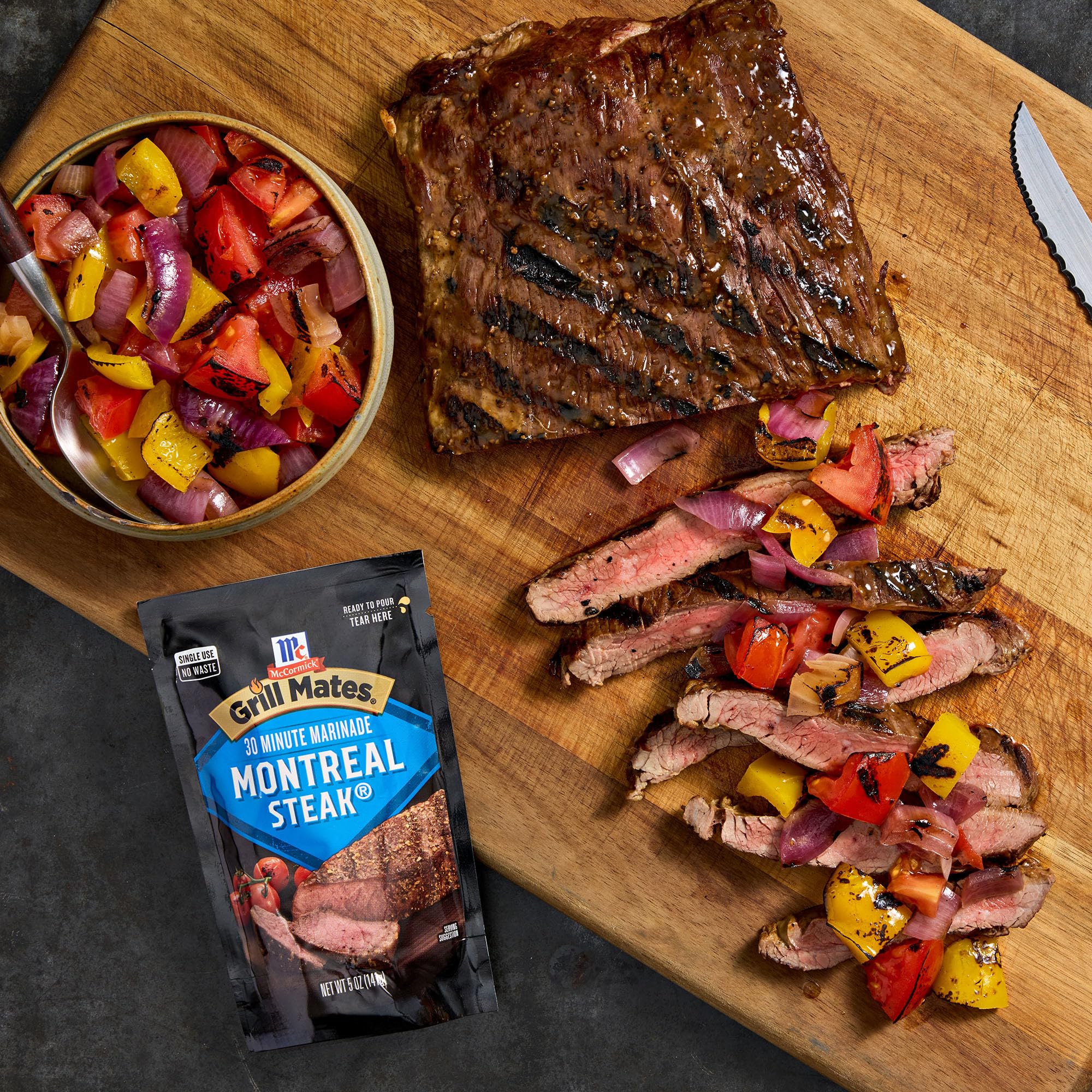 Grill Mates marinated steak sizzling on grill for bold taste