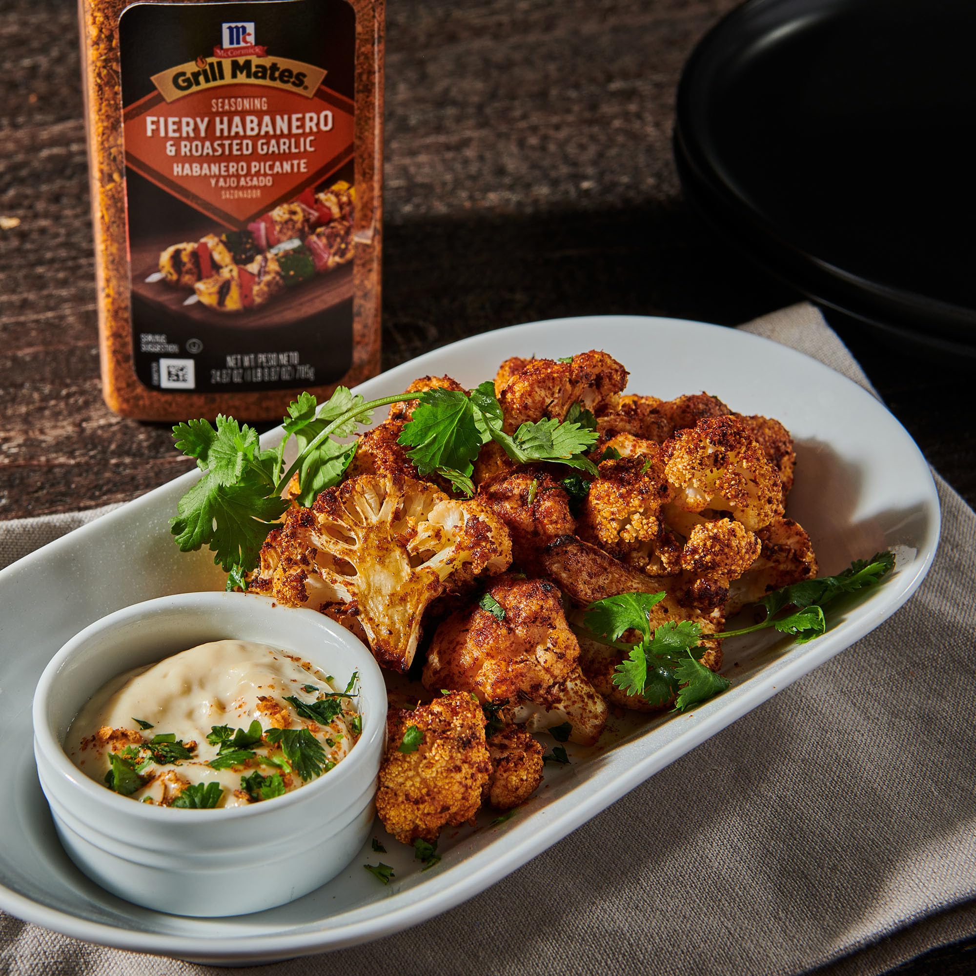Grill Mates jar by a backyard grill illustrating quick meal prep benefits