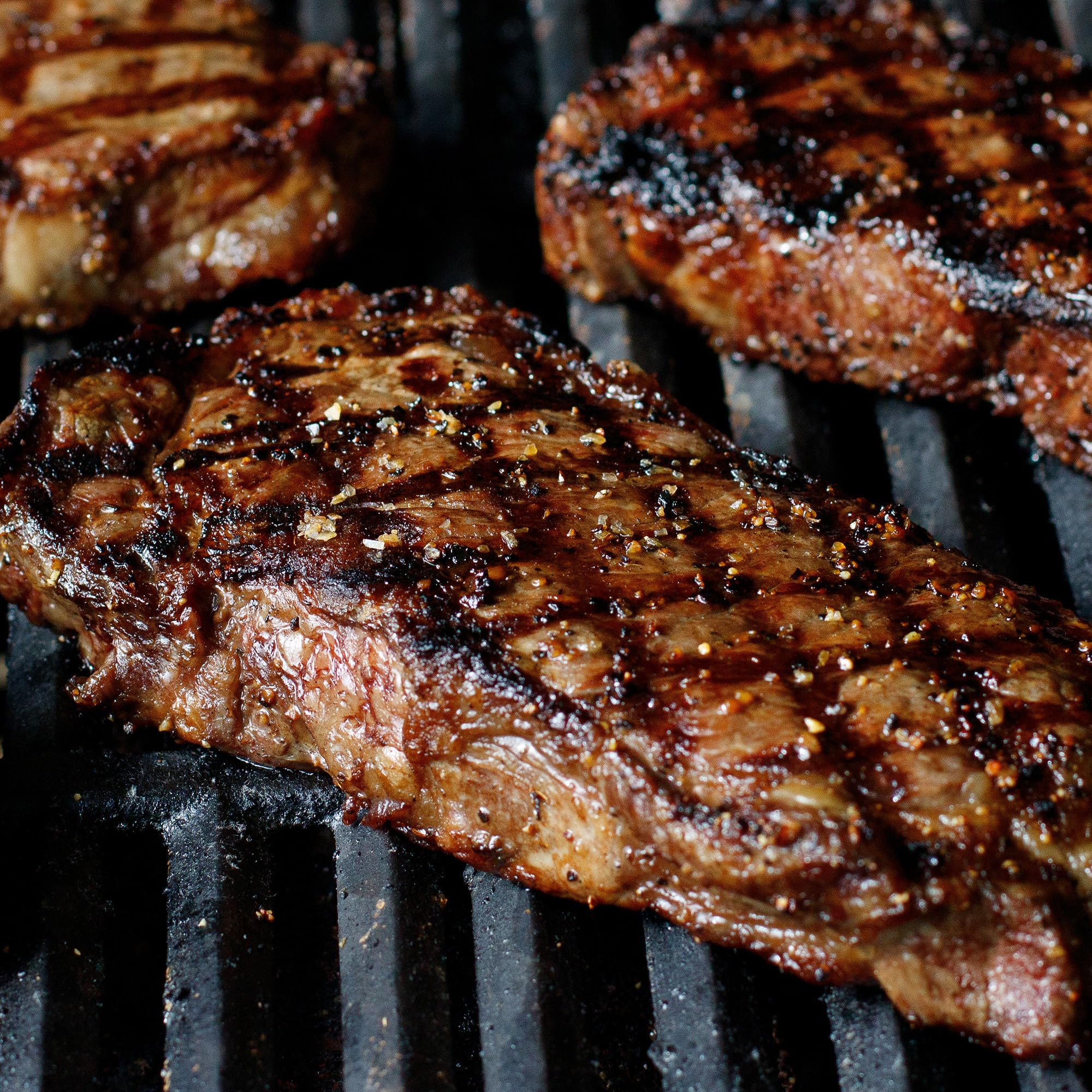 Grill Mates seasoning crusted on a grilled steak, enhances savory char and aroma